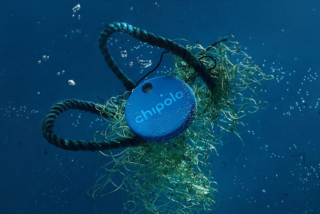 Chipolo One: Ocean Edition tangled in nets and floating in the water
