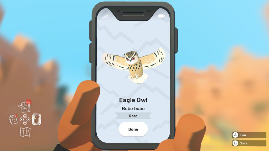 A mobile phone with an image of an Eagle Owl on the screen