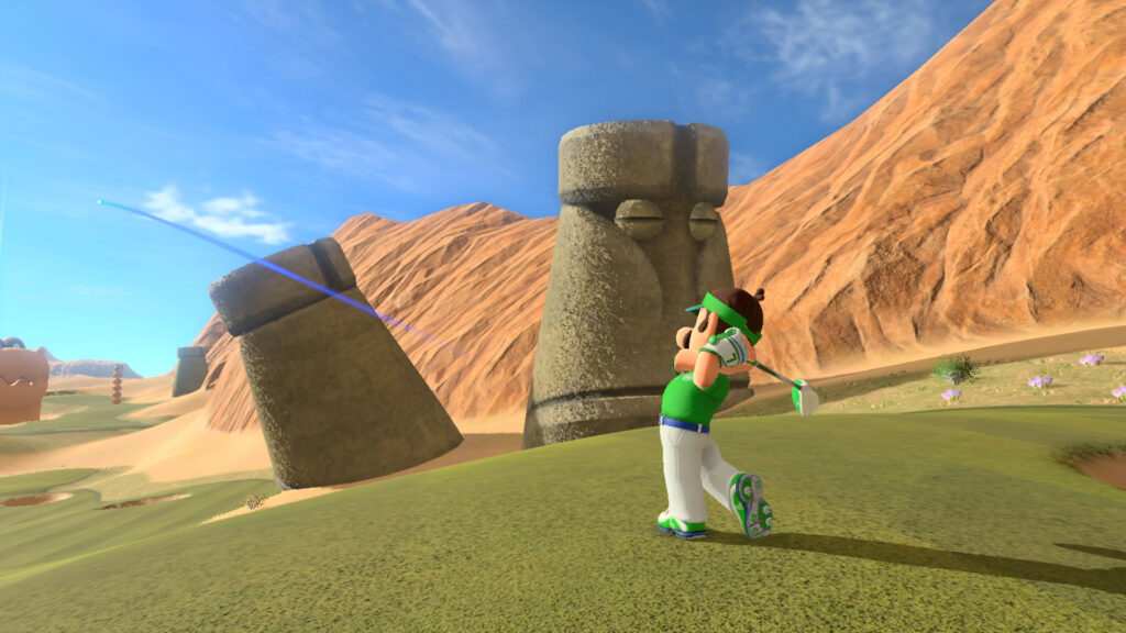 Mario Golf: Super Rush Luigi putting golf next to some stone statue heads.