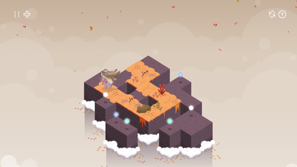 The player character leaves a trail of orange leaves across one of the puzzle stages