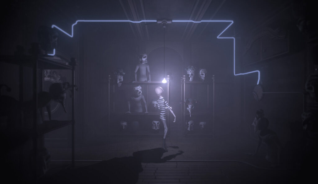 Dolls and puppets in the background and foreground with a light bulb and male character in the centre