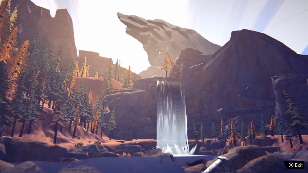 A waterfall flowing through sharp mountains