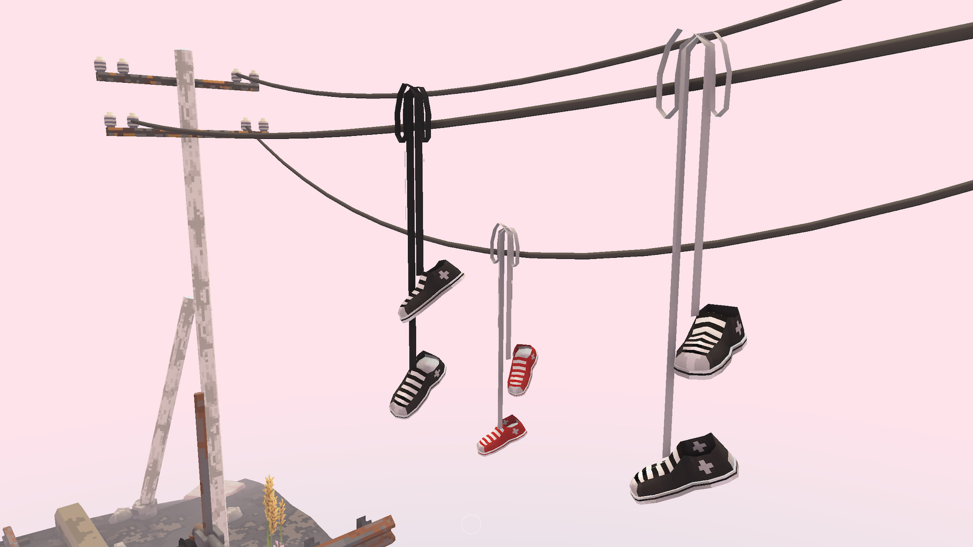 Trainers hang by their laces from electrical wires.