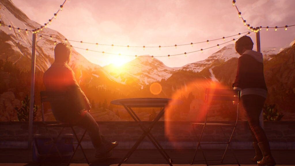 Gabe and Alex watch the sun set behind the mountains from a rooftop garden.