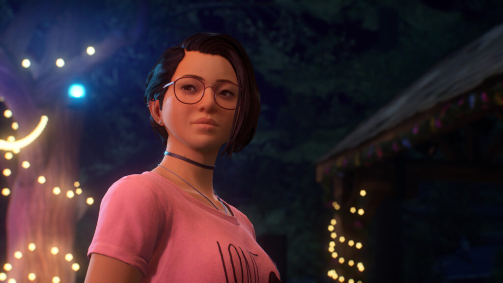 Alex wearing Max's iconic deer t-shirt at night in the summer festival.