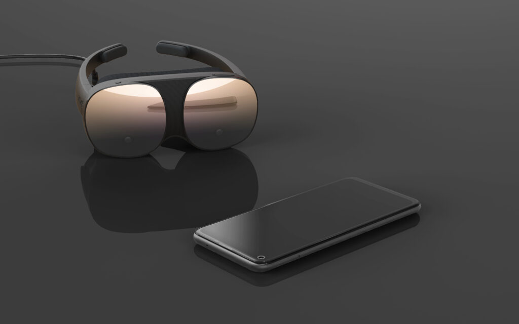 The Vive Flow next to a phone