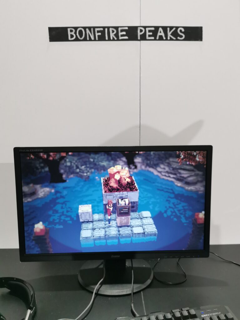 A PC screen at the Bonfire Peaks EGX booth showcasing the game.