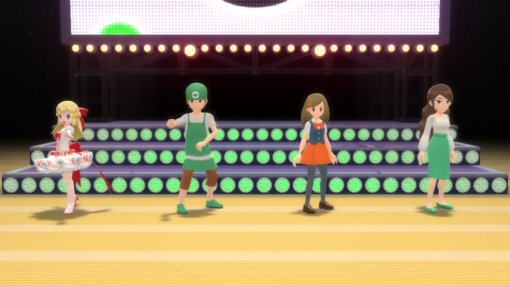 Four Pokémon trainers stand on a brightly lit stage at a Super Contest Show.
