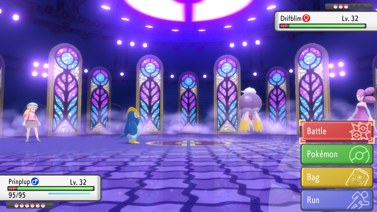 Facing Gym Leader Fantina’s Drifblim with my Prinplup, in a purple, stained glass window stage.