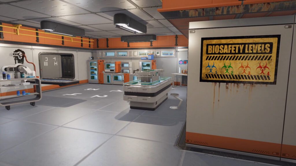 Another view of the lab, this time we see the overall room. A bio safety level poster on the wall, and a view of benches with lab equipment.