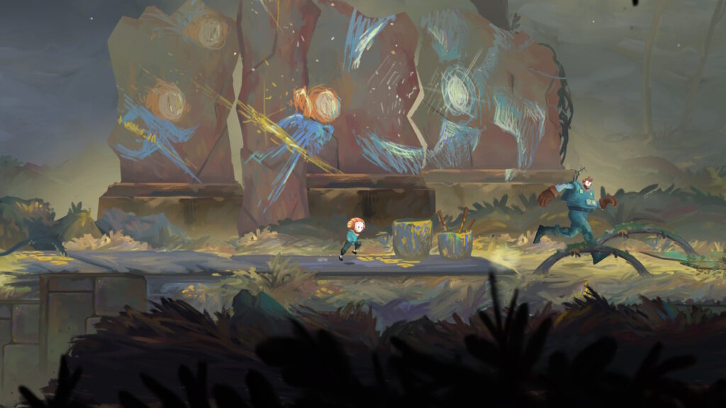 rock painted with images of the cat man and the little man fighting a metal beast
