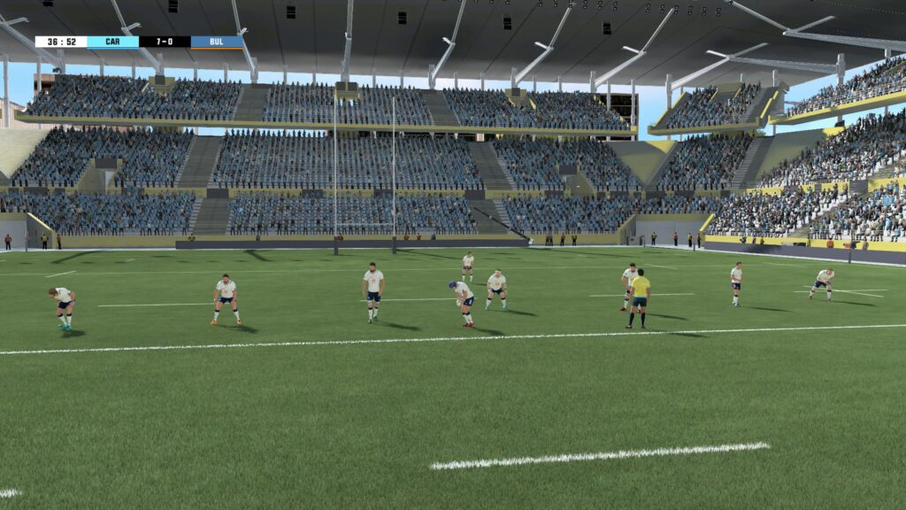 Players stand behind a teammate as he prepares to kick the ball