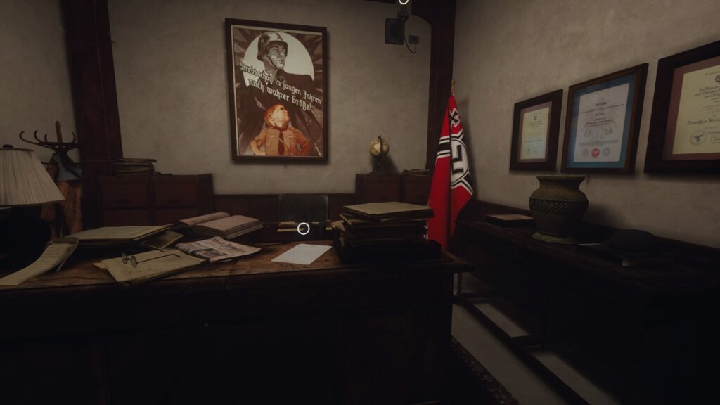 a desk littered with books with a Nazi flag in the corner and a war propaganda poster on the wall