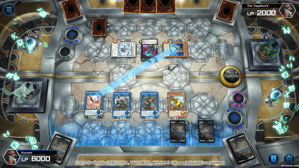 Several Yu-Gi-Oh! cards lie face up, having been played