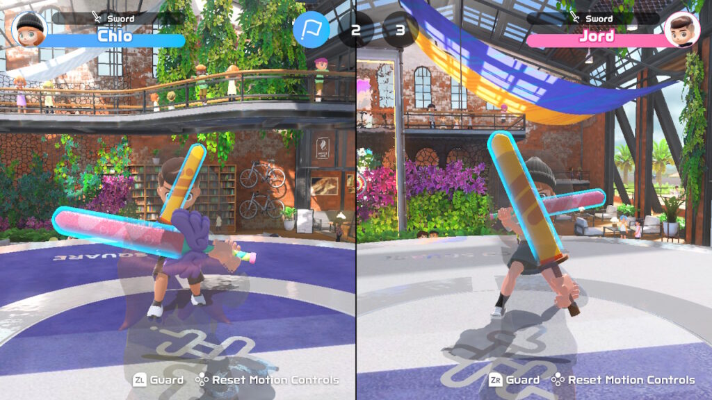 A chambara match between two local players, with the screen split.