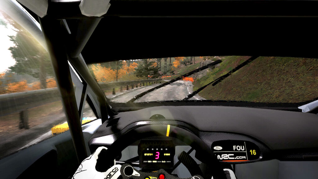 WRC 10 - Cockpit camera view with car driving towards left bend in Autumn weather