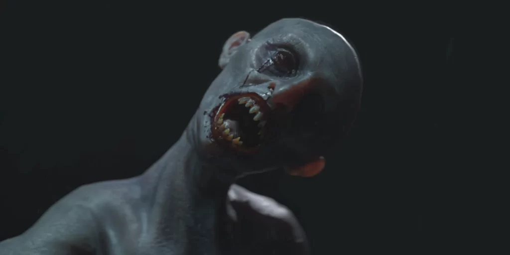 A creature bares its teeth at the camera