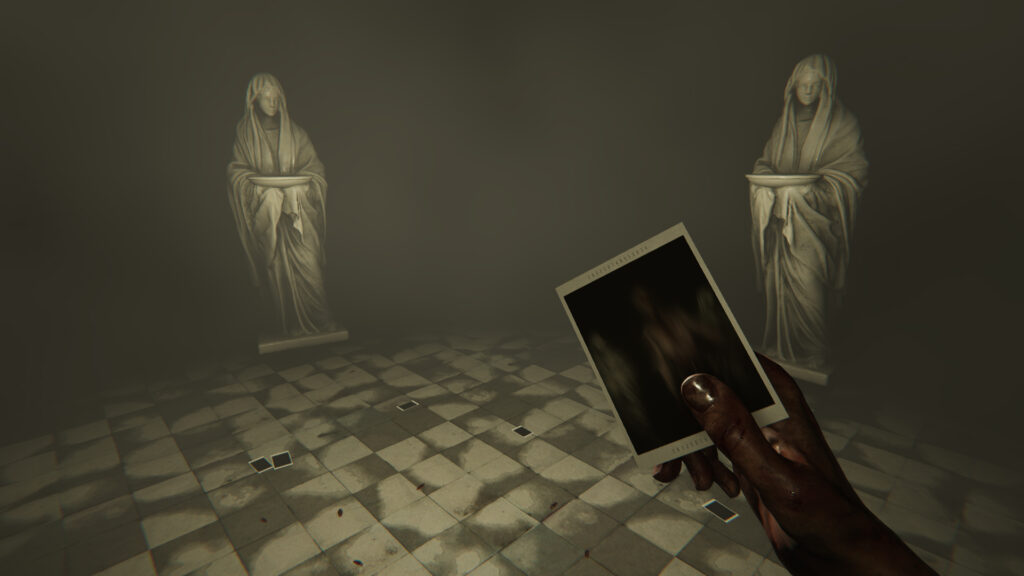 The main character holds a Polaroid picture, as two white statues stare in the background.
