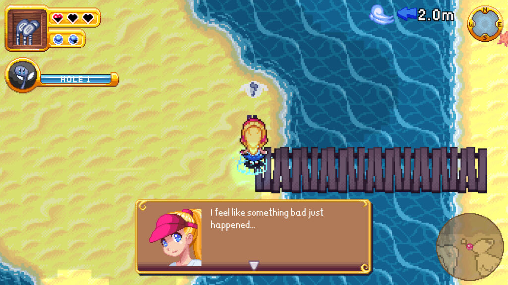 Aerin stands beside a bridge connecting two sandy land masses