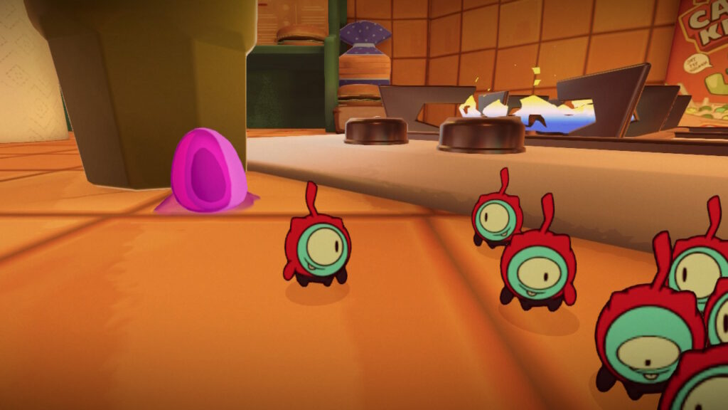 Red tinykin are pictured next to kitchen items