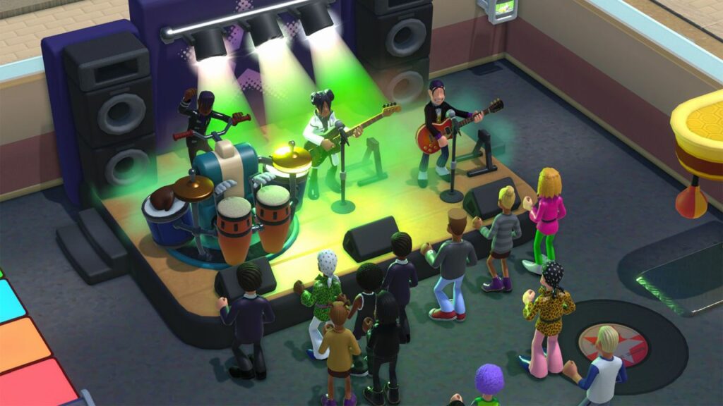 students standing on a stage playing music as other students watch