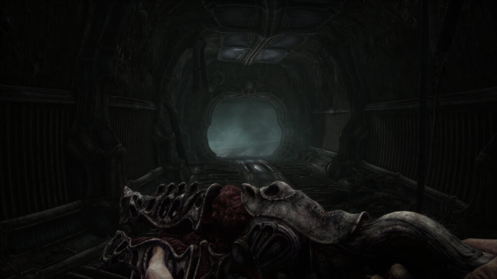 A tunnel and view of a powerful shotgun-style weapon in the game Scorn