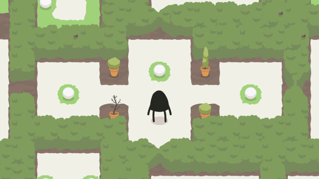 An animated shadow character looks onward to a snowball surrounded by a green grass circle.