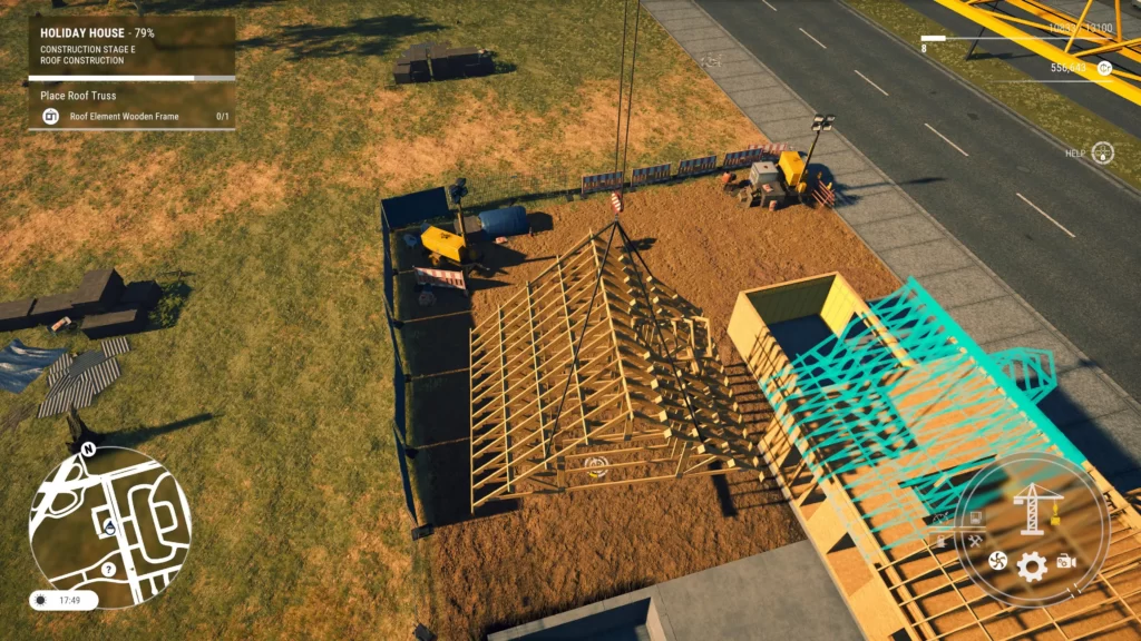 A crane lifts a roof on top of a house on a construction site