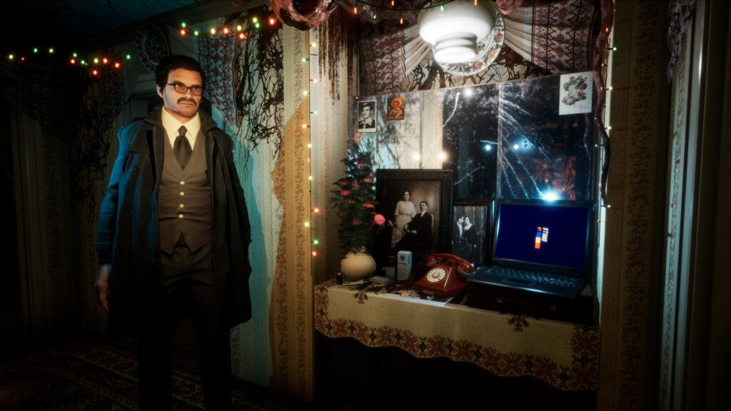 man standing near a computer and photos