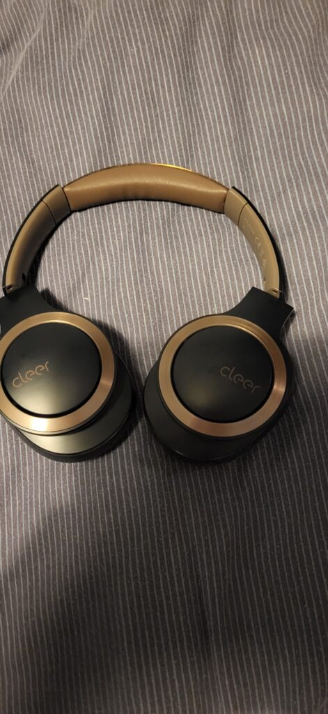 The Enduro ANC Noise Cancelling Headphones on a duvet