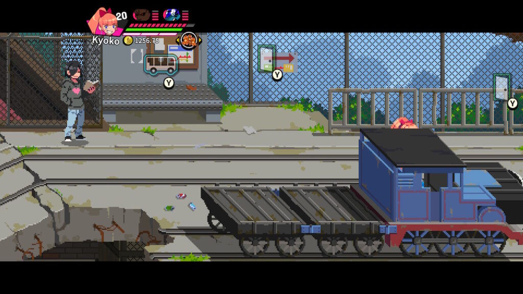 kyoko hiding behind a train that looks awfully similar to thomas the tank engine