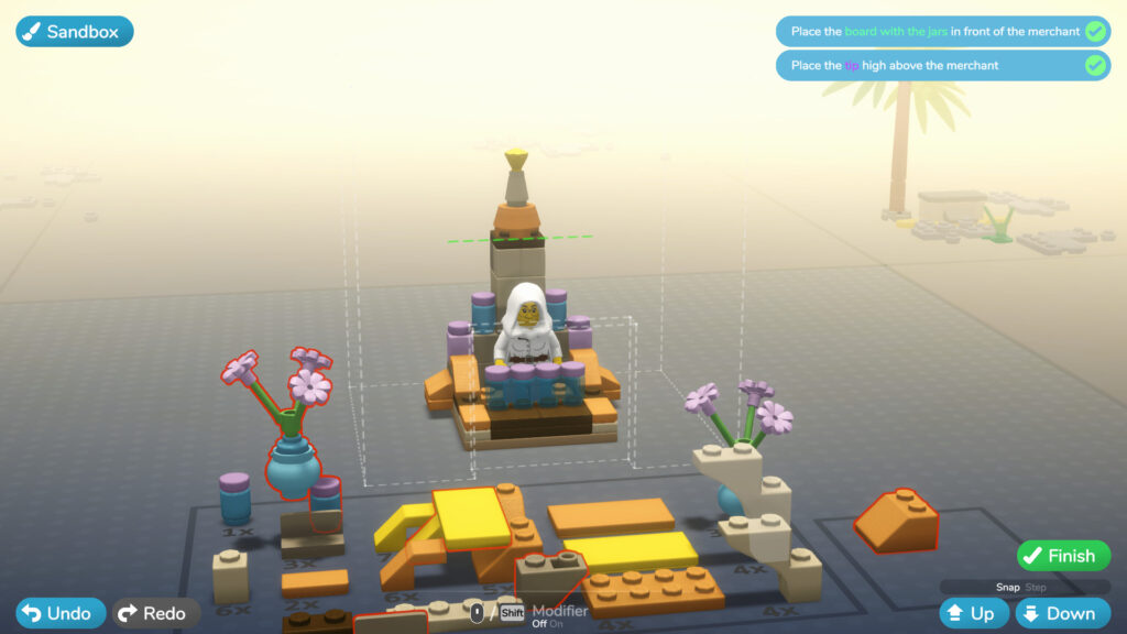 A merchant is surrounded by colourful LEGO pieces in a chair-like structure
