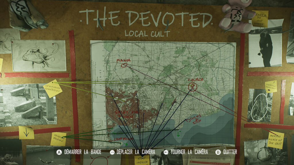 A board with information, maps and photos pinned on it about a local cult called The Devoted