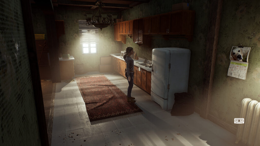 Elise stands in the kitchen in front of the fridge