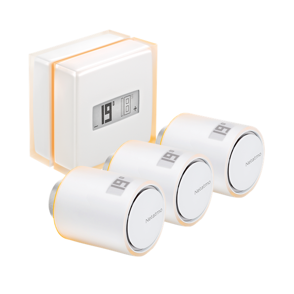The Smart Thermostat beside three radiator valves