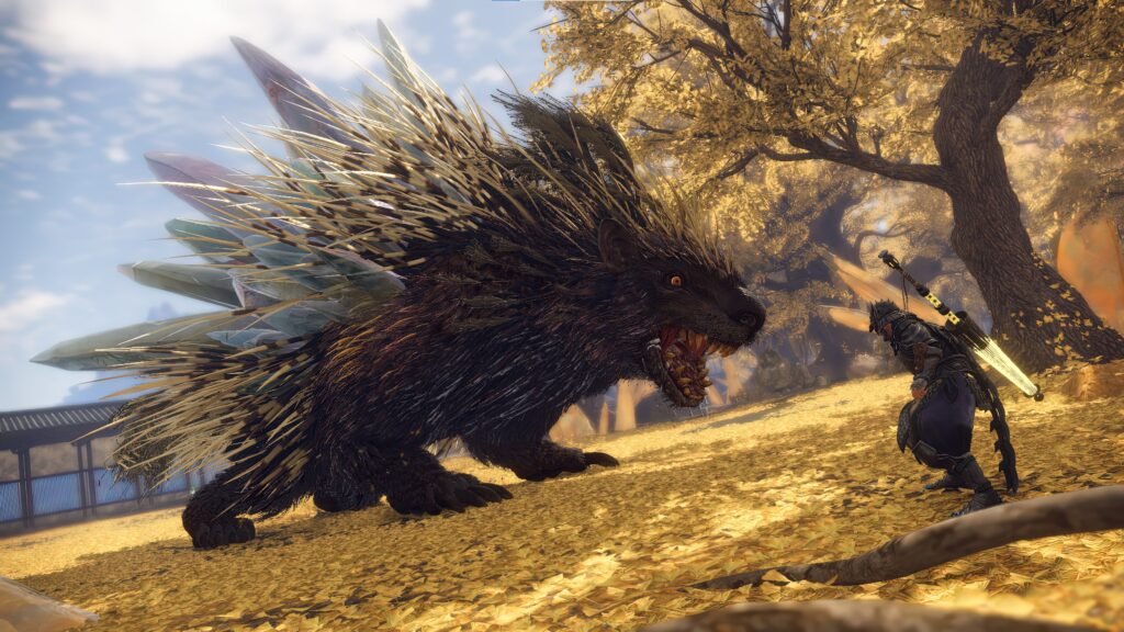 an enormous beast resembling a porcupine with sharp teeth faces a character poised ready to fight