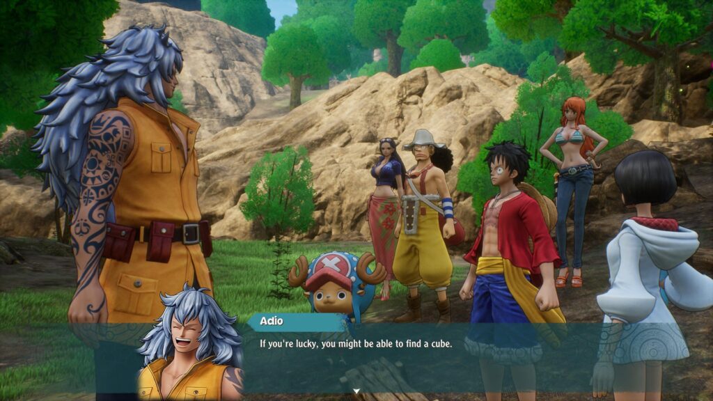 Adio talks to a group of characters with trees, grass and rocky outcrops in the background. Test onscreen reads: Adio: If you're lucky, you might be able to find a cube.