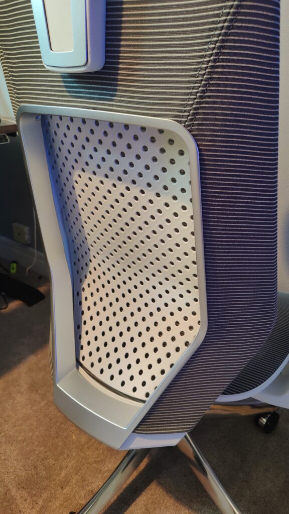 An image of the back of the B11 Pro shows a plastic chair back dozens of equally spaced holes