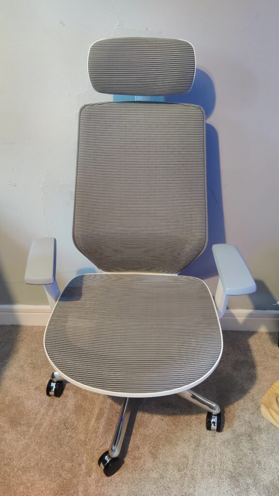The portrait image of an office chair shows a sleek grey design