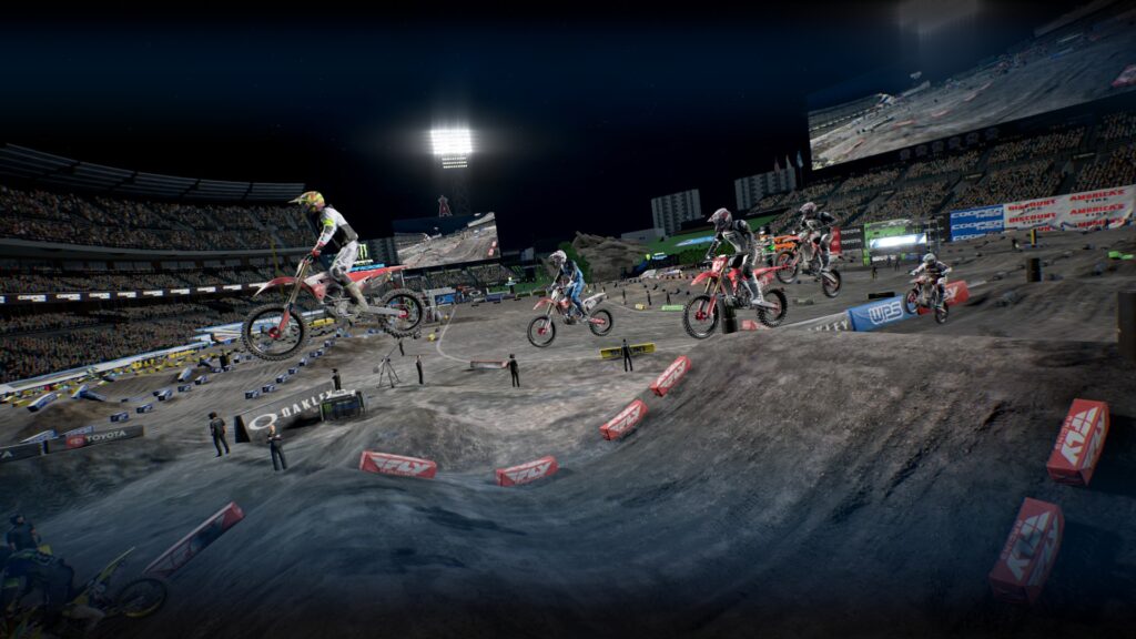 5 Riders taking a big jump in Angels Stadium in Anaheim, California.