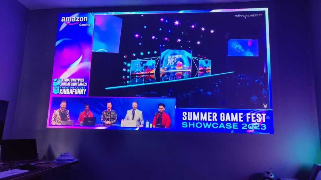 Summer Games Fest stage is shown; basking the walls in a purple hue