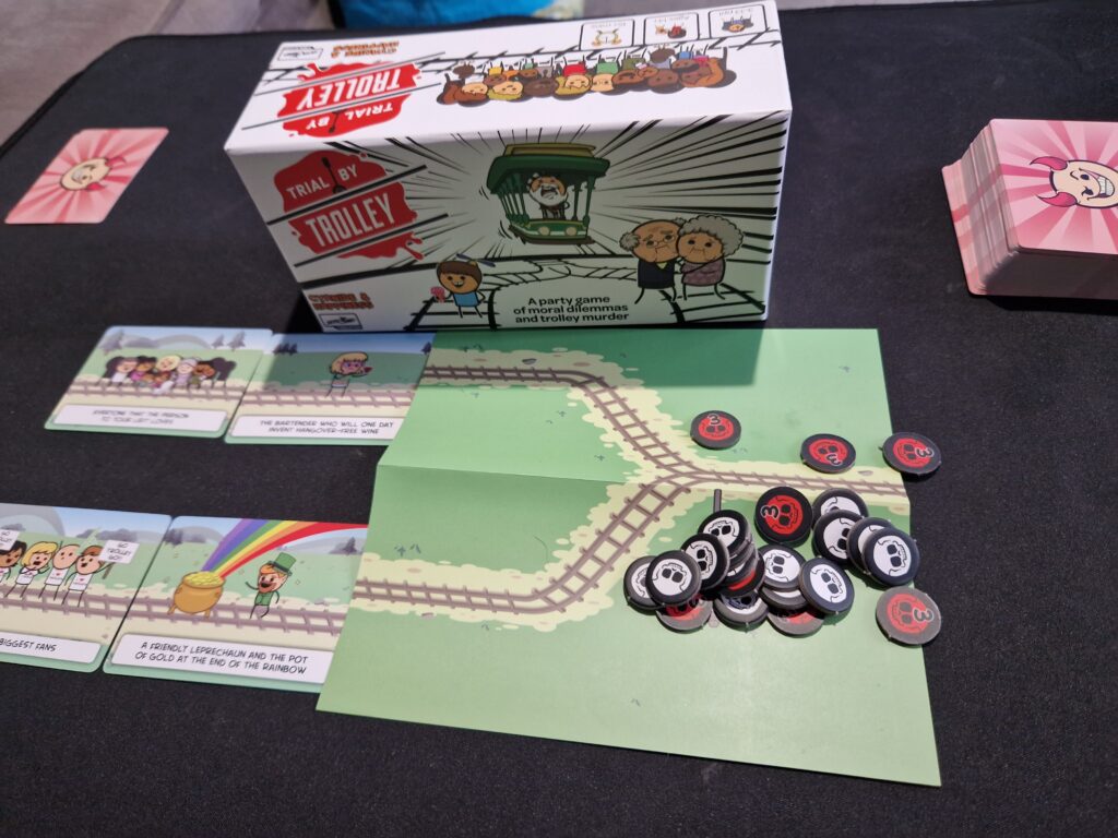 Trial by Trolley game set up with cards and tokens.