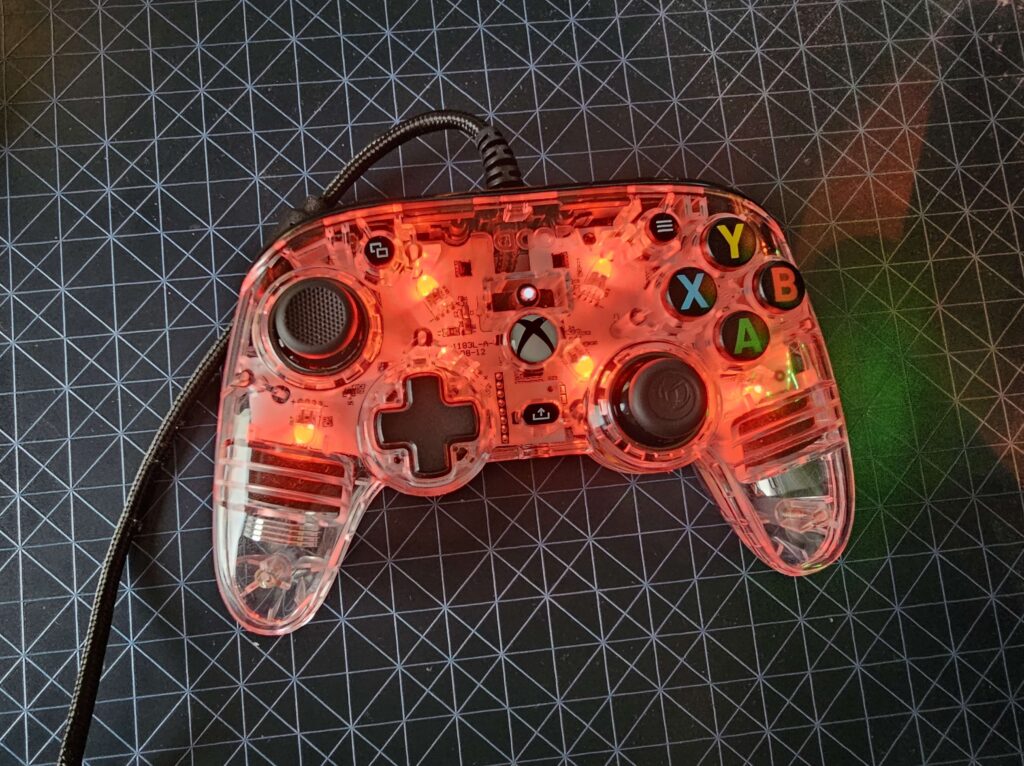 The Nacon Pro Compact Controller Colorlight wth red lights