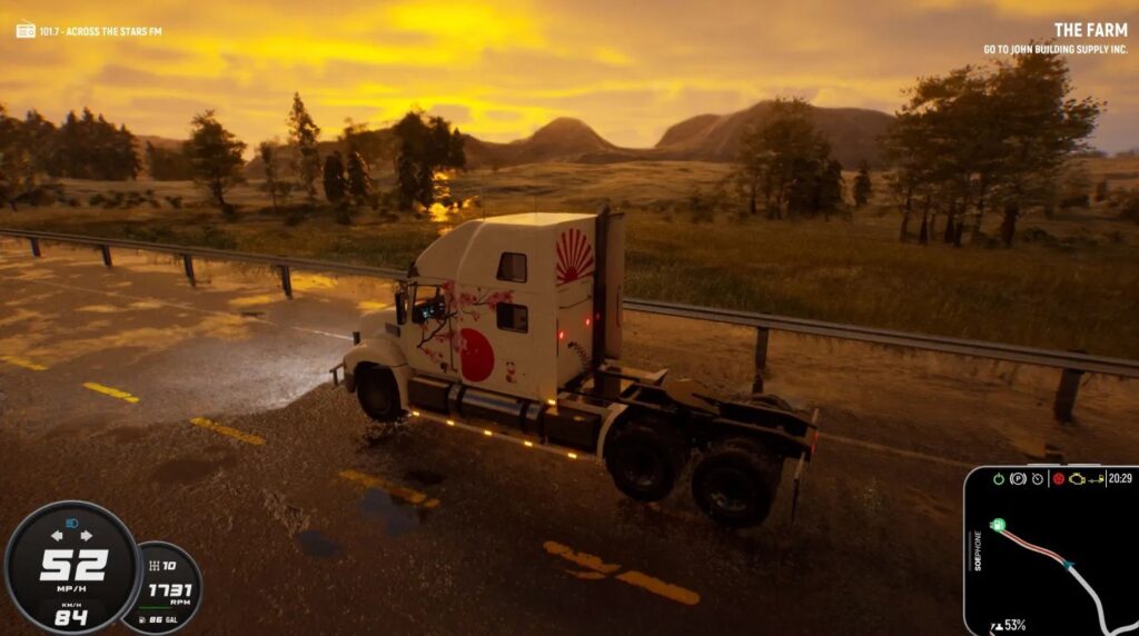 Side on view of a truck with the sun setting in the background.