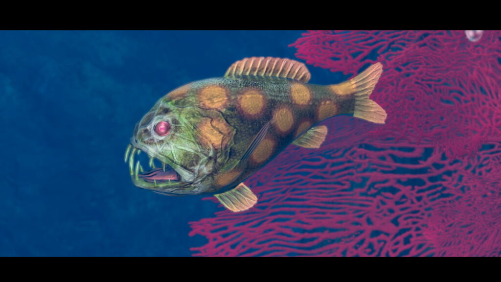 A green fish with a yellow-dotted body swims from right to left. Behind it pink coral against the dark blue ocean can seen.