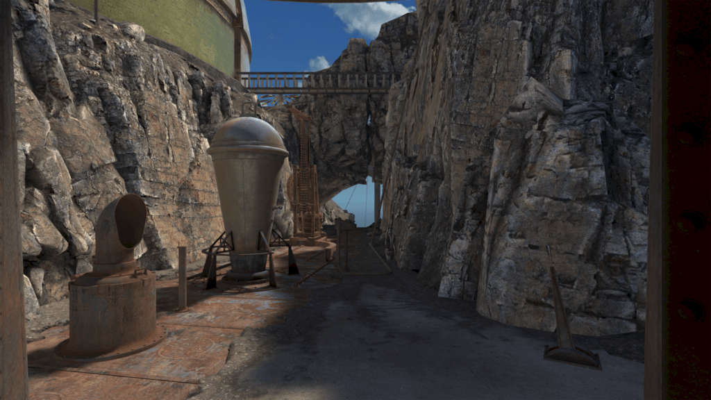 The world of Riven has rock walls on both sides of you. In front of you are several pieces of old equipment made of metal.