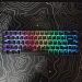 Image showing the Flux 65 Keyboard with RGB lighting sitting on top of the Obsidian Glass Mousepad