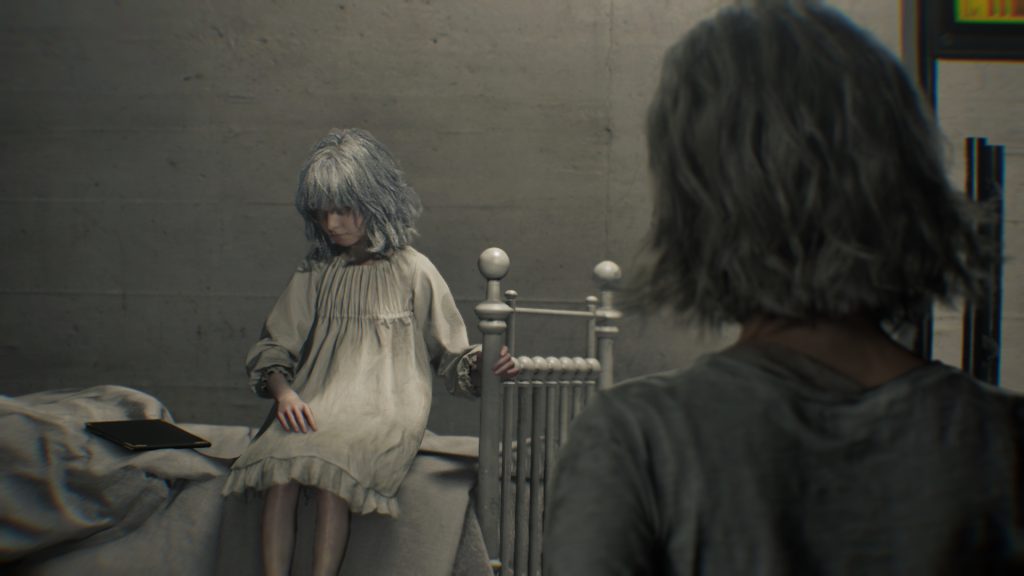 Grace approaches a little girl with white hair sitting on a bed in a glass room.